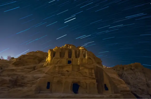  ?? ?? Top: Star trails over a tomb in The Siq. This 45-minute exposure is formed from 90 exposures, each of 30 seconds, with a final shot for the foreground. Above left: Ruined kasbahs of Ait Benhaddhou, Morocco. This is a stack of 115 individual 30-second exposures, with a combined exposure of almost an hour. Above right: Quiver Tree Forest in Namibia. I only managed 36 images of 30 seconds before clouds rolled in.