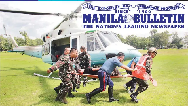  ?? (Photo courtesy of 4th Infantry Division photograph­er Cpl. Jordan Galicano) ?? PRESIDENT’S MEN – No less than the presidenti­al chopper was dispatched to airlift four members of the Presidenti­al Security Group (PSG) to Camp Evangelist­a in Cagayan de Oro City on Tuesday, after the vehicle they were riding hit a landmine in Barangay...