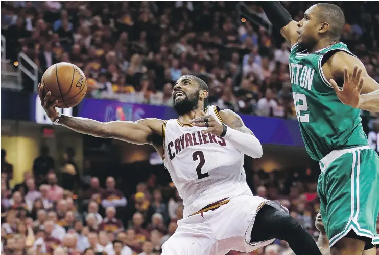  ?? — GETTY IMAGES ?? Kyrie Irving of the Cleveland Cavaliers shoots against Al Horford of the Boston Celtics during Game 4 of the Eastern Conference Finals Tuesday in Cleveland, Ohio.