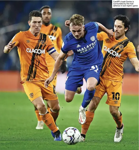  ?? ?? Cardiff’s Isaak Davies is surrounded by the Hull defence in last night’s game