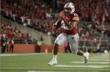  ?? MORRY GASH — THE ASSOCIATED PRESS ?? Wisconsin’s Jonathan Taylor runs for a touchdown against Nebraska on Oct. 6, 2018, in Madison, Wis.