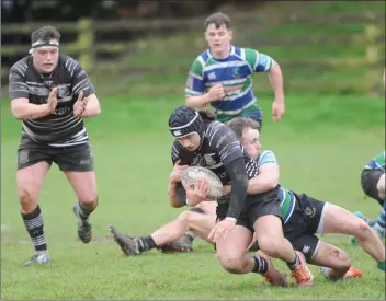  ??  ?? Gorey’s Aaron Davies tackles Willie Schutz (Dundalk) in the clash at Mill Road on Saturday.