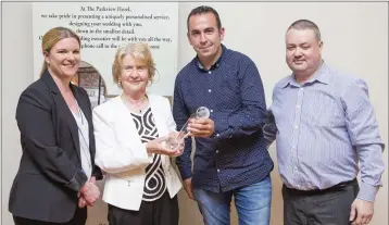  ??  ?? Duty Manager of the Parkview Hotel Cliona McGloughli­n, Phyl McEvoy and Eoin Devlin present Barry Mernagh of Rathnew AFC with the Andy McEvoy Premier Division Manager of the Year Award.