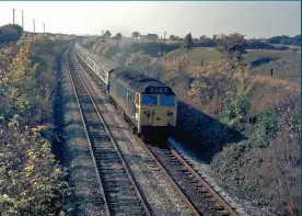  ??  ?? Travel-stained 50040 passes Westhought­on on October 15, 1975 with a diverted Scottish-bound working. This diversiona­ry route was used when the WCML was closed north of Wigan. (Gerry Bent)