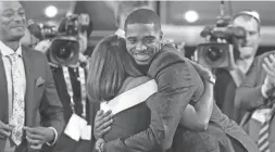  ??  ?? Villanova’s Mikal Bridges is greeted by friends and family after he was picked 10th overall by the Philadelph­ia 76ers on Thursday.