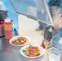  ?? Carter Hiyama For The Times ?? A CUSTOMER picks up an order at the Mariscos Jalisco food truck on the industrial strip of Olympic Boulevard; Andi Xoch, founder of Latinx With Plants; the recently revamped 6th Street Bridge invites selfies.