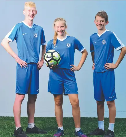  ?? Picture: ZAK SIMMONDS ?? REAL KICK: Kirwan High’s Brayden Smith, Zailey Barker and Riley Bakonyi will attend the football academy.