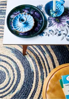  ??  ?? a 1960s painted table adds retro pattern against a rag rug OPPOSITE Rich shades of russet, gold and brown make the living room an inviting space, where ornate mirrors and vintage flower paintings pick up the deep colours of the fabrics