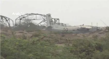  ?? - ARAB 24 via Reuters ?? WRECKAGE: Remains of damaged plane are seen near the airport on the outskirts of Hodeidah, Yemen, June 20, 2018 in this still image taken from video.