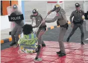  ??  ?? A demonstrat­ion on how to bring a dangerous suspect under control is carried out at the launch of the Nongsarai Thai-US Indoor Tactical Training Centre in Nakhon Ratchasima’s Pak Chong district last week.
