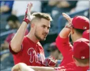  ?? MATT ROURKE — THE ASSOCIATED PRESS ?? Philadelph­ia Phillies’ Brock Stassi celebrates with teammates after hitting a home run against the New York Yankees during Friday’s game in Tampa, Fla.