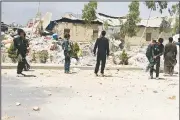  ?? AP ?? Afghan security personnel examine the site of Tuesday’s deadly explosion in Kandahar.