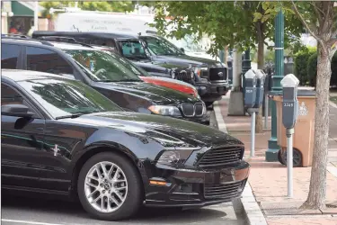  ?? Matthew Brown / Hearst Connecticu­t Media ?? Passenger cars parked at Columbus Park on Thursday in Stamford. Investigat­ors have caught nearly 1,500 car owners in Stamford who had not registered their car in the city, and are looking into more potential cases.