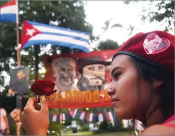  ?? NORBERTO DUARTE/AFP ?? Supporters of Paraguay’s Communist Party gather in Asuncion to pay tribute to Cuban Fidel Castro on Saturday.