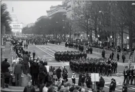  ?? ASSOCIATED PRESS ?? IN THIS JAN. 20, 2017, FILE PHOTO, military units participat­e in the inaugural parade from the Capitol to the White House in Washington. A U.S. official says the 2018 Veterans Day military parade ordered up by President Donald Trump would cost about $92 million – more than three times the maximum initial estimate.