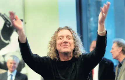  ??  ?? Robert Plant conducting the school orchestra at the opening of the new music block at Wolverhamp­ton Grammar School in 2005