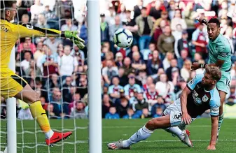  ?? REUTERS ?? On the money: Aubameyang scores his second goal against Burnley, claiming the Golden Boot alongside Salah and Mane with 22 goals