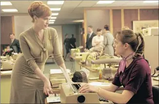  ?? Doug Hyun AMC ?? JOAN (CHRISTINA HENDRICKS) , left, and Peggy (Elisabeth Moss), shown in the first season of “Mad Men,” unwittingl­y break barriers in the workplace over the course of the show’s run.