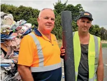  ?? KELLEY TANTAU/STUFF ?? Smart Environmen­tal’s Layne Sefton and Future Post general manager Jerome Wenzlick with a fence post made from recycled plastic.