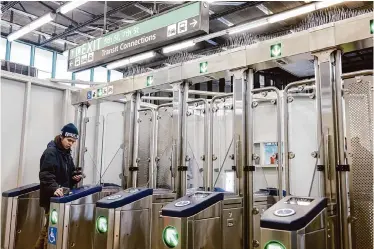  ?? Photos by Santiago Mejia/The Chronicle ?? BART’s new fare gates at the West Oakland BART Station are the first of the transit system’s rollout.