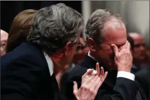  ?? The Associated Press ?? STATE FUNERAL: Former President George W. Bush, right, cries after speaking during the State Funeral for his father, former President George H.W. Bush, Wednesday at the National Cathedral in Washington.