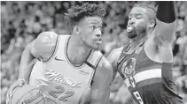  ?? JOHN MCCALL/SUN SENTINEL ?? The ties between the Heat’s Jimmy Butler, left, and Bucks’ Wesley Matthews date to their time at Marquette.