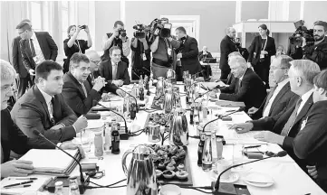  ??  ?? Ukraine’s Foreign Minister Pavlo Klimkin (second left), German Foreign Minister Sigmar Gabriel (third left), Ayrault (second right) and Lavrov (third right) sit down for talks in the so-called Normandy format at the 53rd Munich Security Conference...