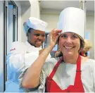  ?? Picture: BERNA WALTERS ?? CHEF FOR A NIGHT: Khanyisa Banisi, back, helped Sue van Staaden with her chef’s hat before making delicious Thai dishes at The Herald Cooking Master Class at Capsicum Culinary Studio in Newton Park last Thursday