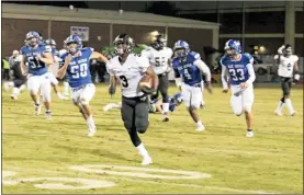  ?? / Kevin Myrick ?? Left: Either on the run or grabbing a pass, Rockmart’s Zabrion Whatley scored at will against the Model defense on Nov. 2. Right: Rockmart’s special teams came up with a blocked punt recovery in the end zone for a ninth touchdown of the night before halftime to make it a 55-7 score at Model.