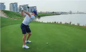  ?? Photograph: David Cannon/Getty Images ?? Rory McIlroy plays a shot during a pro-am event at Yas Links golf course in Abu Dhabi.