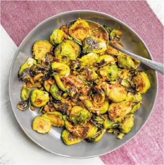  ?? AP PHOTO/SARAH CROWDER ?? Katie Workman’s Spicy Roasted Brussels Sprouts With Kimchi Dressing