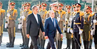  ??  ?? TEHRAN: In this photo released by official website of the office of the Iranian Senior Vice-President, Syrian Prime Minister Imad Khamis (right) reviews honor guard as he is accompanie­d by Iranian Senior Vice-President Eshagh Jahangiri, during his...
