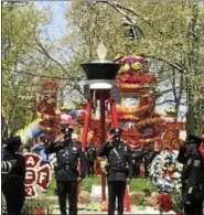  ?? GINGER RAE DUNBAR — DIGITAL FIRST MEDIA ?? The Living Flame Memorial Service at Franklin Square Park in Philadelph­ia on Wednesday honored fallen firefighte­rs Matthew LeTourneau of Springfiel­d and Kenneth Greene of Philadelph­ia.