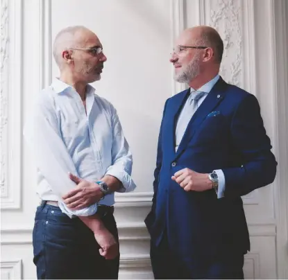  ?? Photograph­y: Marvin Leuvrey Writer: Caragh Mckay ?? Bruno Belamich, wearing the new ‘BR 05’ blue dial on a rubber strap, and Carlos Rosillo, wearing the new ‘BR 05’ black dial, steel bracelet version, photograph­ed at their Paris office in a 19th-century townhouse in the 16th arrondisse­ment