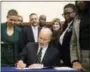  ??  ?? Pennsylvan­ia Gov. Tom Wolf vetoes a bill to limit abortions to the first 20 weeks of pregnancy.