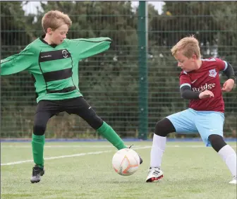  ??  ?? Patrick and Rokus in action as Albion hosted Drogheda boys in Monasterbo­ice recently.