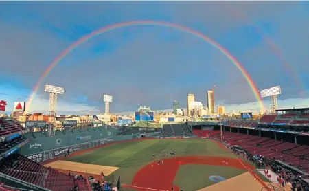  ?? MATT STONE / BOSTON HERALD ?? RAINBOW REDUX: In a repeat of Game 1’s pre-game sky show, a rainbow appears over Fenway Park last night before Game 2 of the World Series against the Los Angeles Dodgers at Fenway Park.