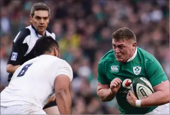  ??  ?? Tadhg Furlong about to be tackled by England’s Billy Vunipola during Saturday’s encounter.