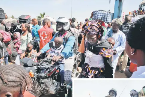  ??  ?? Returnees from Barra seen on arrival at Banjul Port, a day after Jammeh departed Banjul, Gambia for exile. — Reuters photo