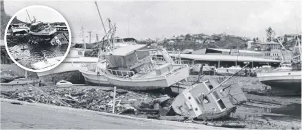  ??  ?? ABOVE AND INSET: Boats washed ashore on Palmer Street during Cyclone Althea in 1971. Picture: TOWNSVILLE CITY LIBRARIES