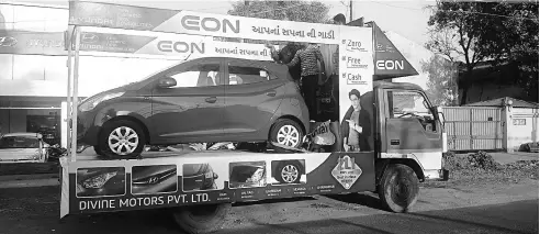  ??  ?? A Hyundai float showcasing its Eon model in Gujarat. In tier-III and tier-IV markets, Hyundai’s focus is on outdoor media owing to lower costs and higher visibility