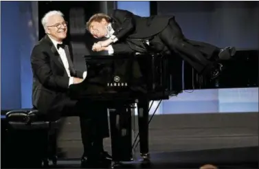  ?? ASSOCIATED PRESS FILE ?? Steve Martin, left, and Martin Short perform together during the 45th AFI Life Achievemen­t Award Tribute to Diane Keaton in June at the Dolby Theatre in Los Angeles.