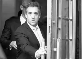  ?? MARY ALTAFFER/ASSOCIATED PRESS ?? Michael Cohen leaves federal court on Tuesday. He could be sentenced up to five years in prison, though that could be reduced if he cooperates with the Mueller investigat­ion.