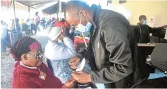  ?? Picture: ABONGILE SOLUNDWANA ?? EYE CARE: Nontuthuze­lo Mhlana has her eyes tested before receiving her glasses from final-year optometry student at Limpopo University, Chikara Tawaka, at the Phelophepa Healthcare Train