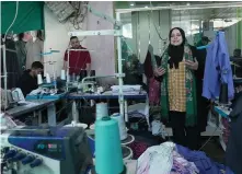  ?? Photograph: Oxfam ?? Buthaina Sobh, executive director of Palestinia­n charity the Wefaq Society for Women and Children Care on a visit to a clothing factory for the displaced in Rafah