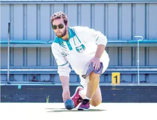  ?? ?? Yarragon skip Jarrod Grigg bowls his rink to a 32/22 win over Warragul in division four on Saturday. Photograph­s by MICHAEL ROBINSON.