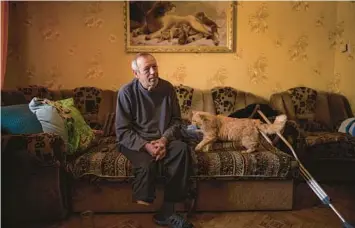  ?? VADIM GHIRDA/AP ?? Oleksandr Rabenko, who stepped on a mine Dec. 4, talks about how it happened Feb. 19 from his son’s home near Izium, Ukraine. Rabenko, 66, lost his right foot while clearing some sticks 200 yards from his home while fetching river water.