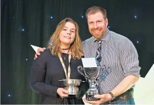  ??  ?? Overall winner Charlie Blance, 20, with farmer comedian Jim Smith.