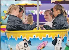  ??  ?? Fun in a teacup at the gala day. IF F26 Caol gala teacup fun