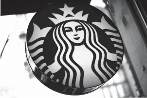  ?? Associated Press ?? ■ Starbucks said Tuesday that it will close more than 8,000 U.S. stores for several hours next month to conduct racial-bias training for its nearly 175,000 workers. The announceme­nt comes after two black men were arrested in a Philadelph­ia Starbucks...